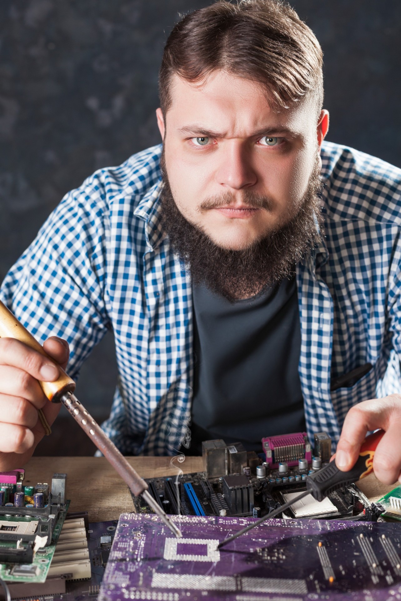 repairman fixing problem with soldering tool p56qraw.jpg